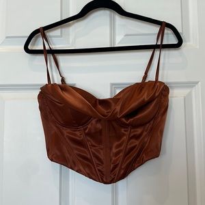 Faux silk crop top with adjustable straps, never worn. Non smoker